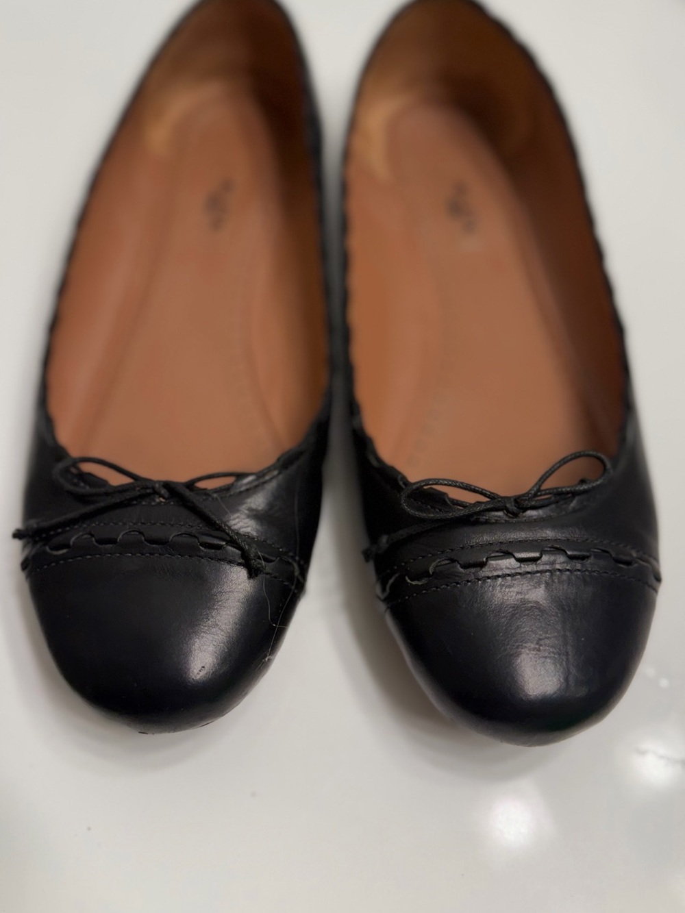 Alaia Black Leather Ballet Flats with Bow Trim